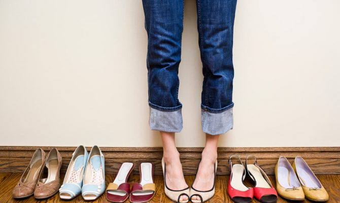 woman-wearing-one-of-many-pairs-of-shoes